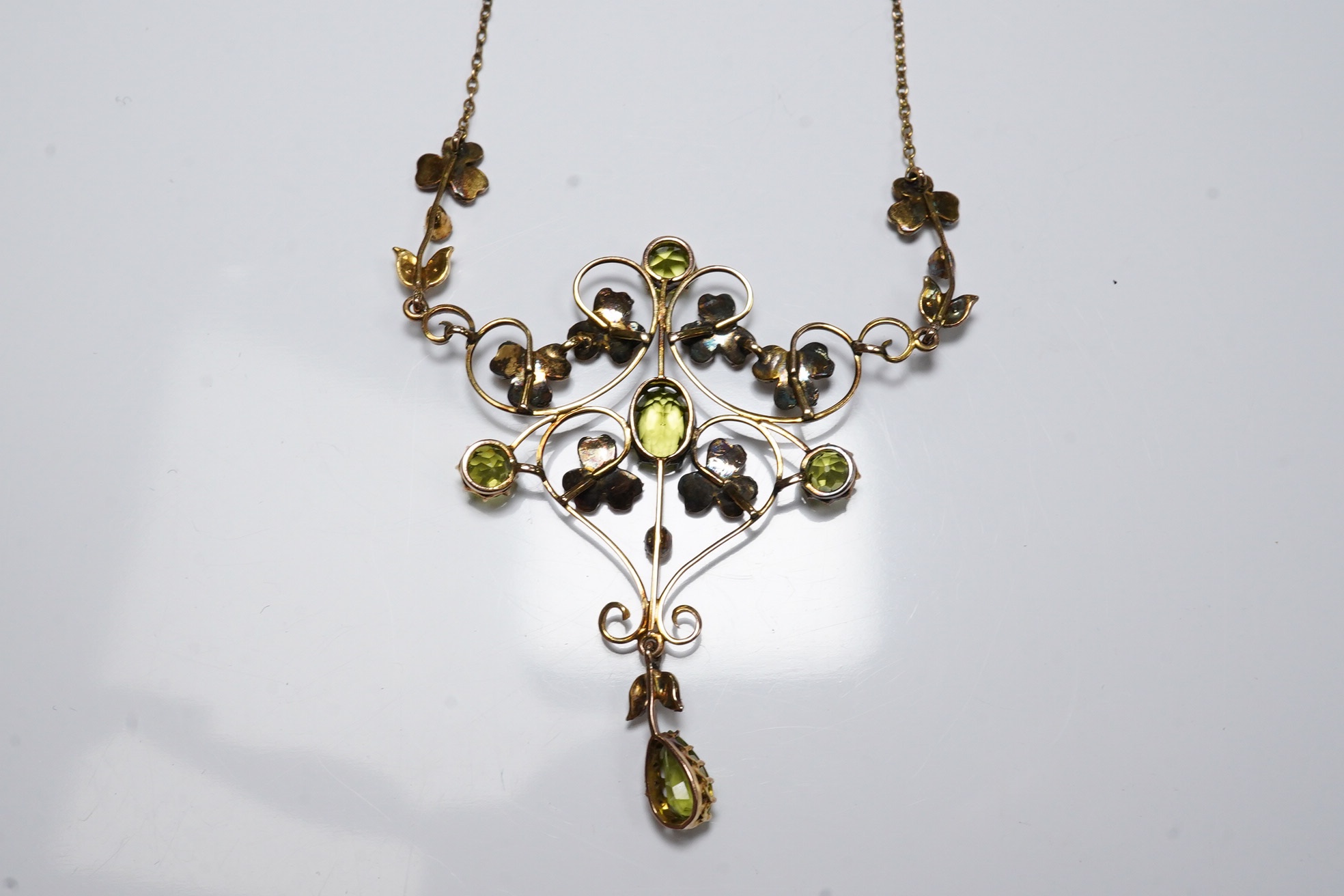 A late Victorian 9ct, peridot and seed pearl cluster set drop pendant necklace, 50cm, gross weight 5.7 grams. Condition - fair to good